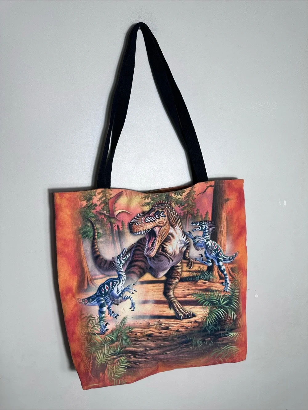 The Mountain Orange Dinosaur Messenger Bag with Black Straps